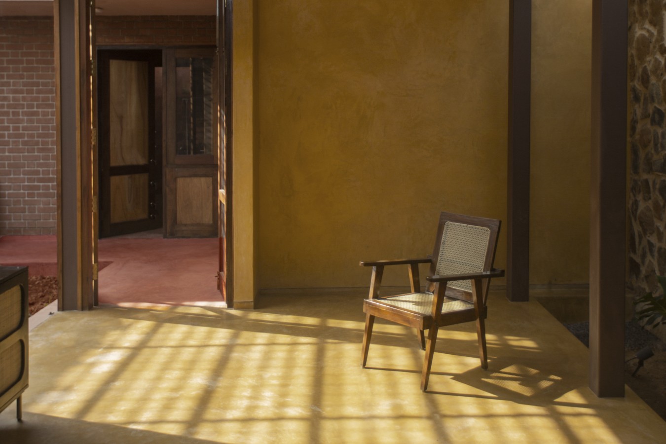 Ochre walls and flooring in entrce courtyard