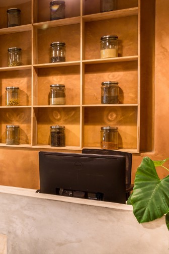 the display shelves behind the reception showcasing samples of organic grains